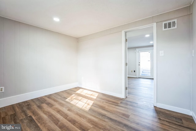 spare room featuring hardwood / wood-style floors