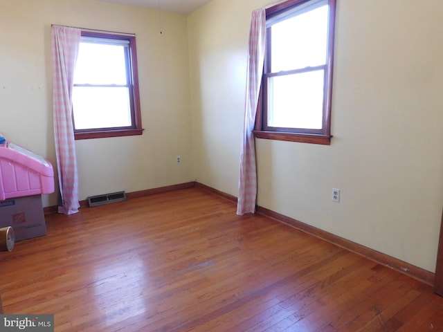 unfurnished bedroom with light wood-type flooring