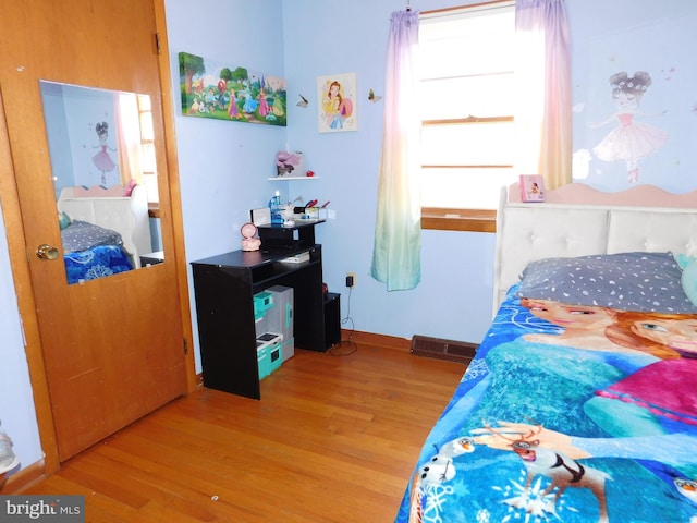 bedroom featuring wood-type flooring