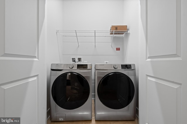 laundry room with washing machine and dryer