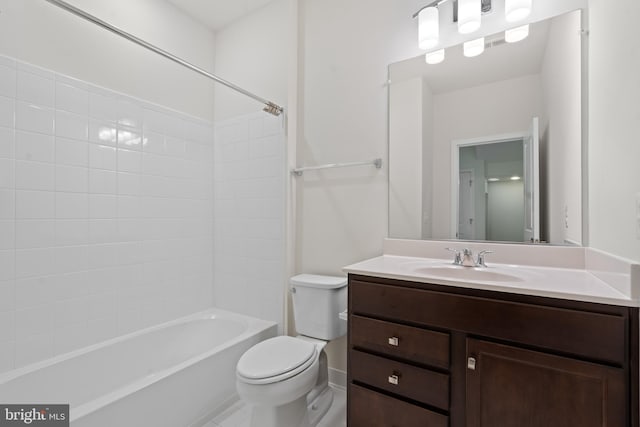 full bathroom featuring bathtub / shower combination, vanity, and toilet