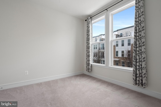 unfurnished room featuring carpet floors