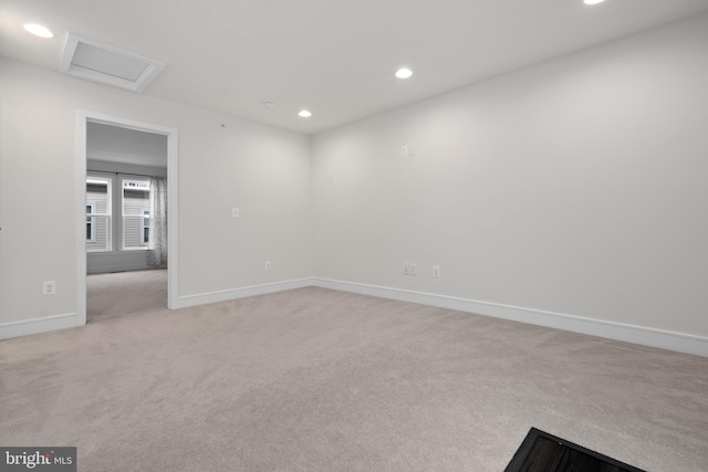 empty room featuring light colored carpet