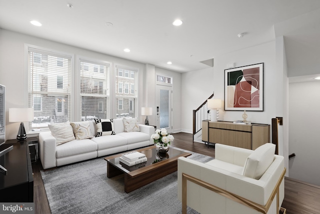 living room with dark hardwood / wood-style flooring