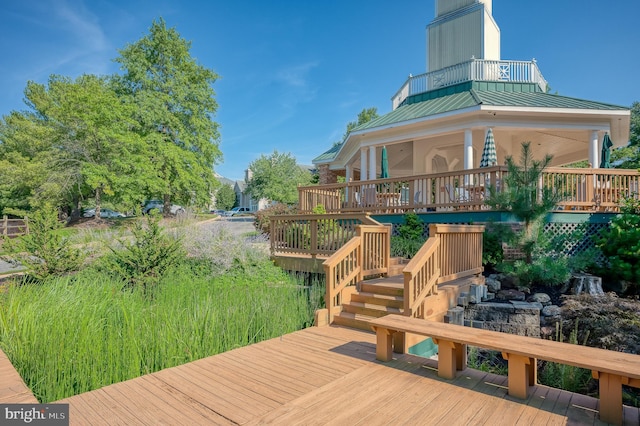 wooden terrace featuring a sunroom