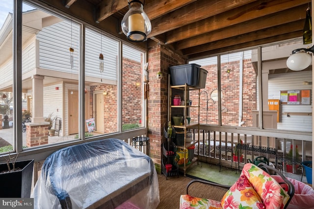 sunroom / solarium with beam ceiling