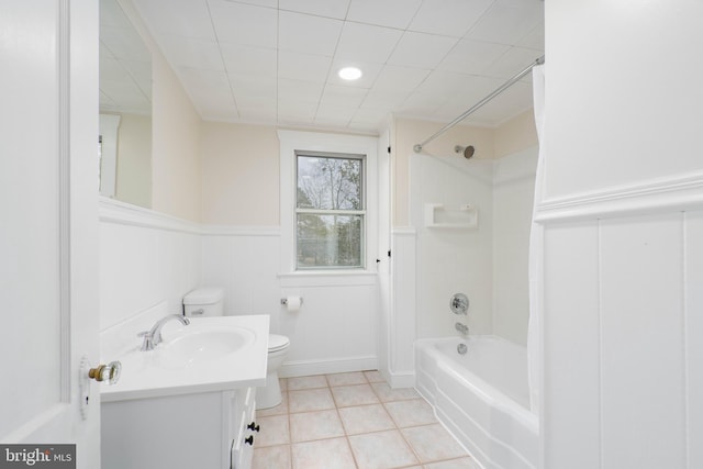 full bathroom with tile patterned flooring, vanity, shower / tub combo with curtain, and toilet