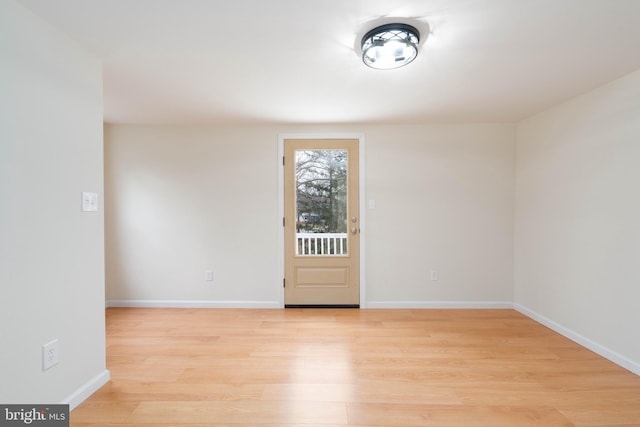 unfurnished room featuring light wood-type flooring