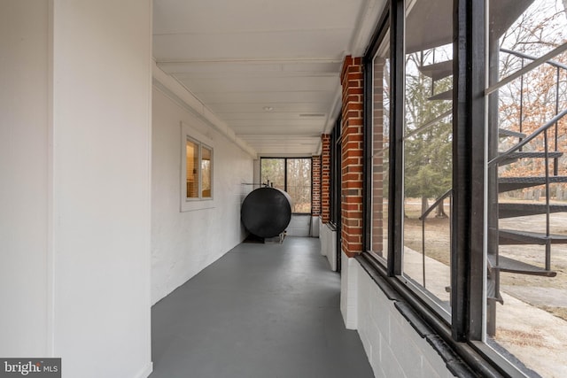 unfurnished sunroom featuring a wealth of natural light