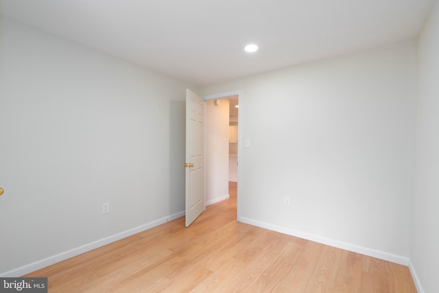 unfurnished room with light hardwood / wood-style flooring