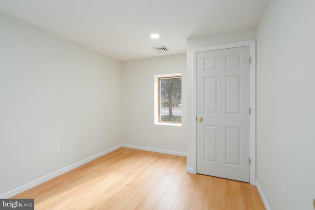 unfurnished room with light hardwood / wood-style flooring