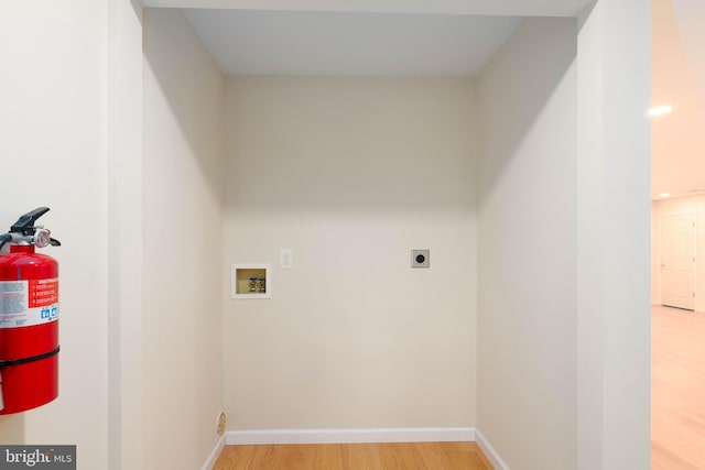 laundry room featuring hookup for a washing machine, hookup for an electric dryer, and hardwood / wood-style flooring