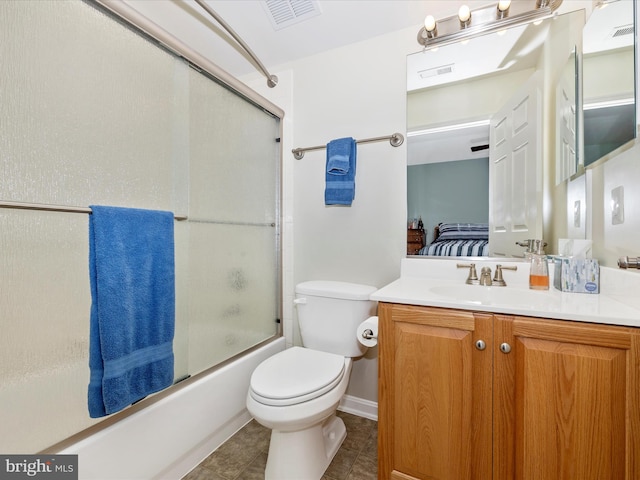 full bathroom with toilet, shower / bath combination with glass door, and vanity