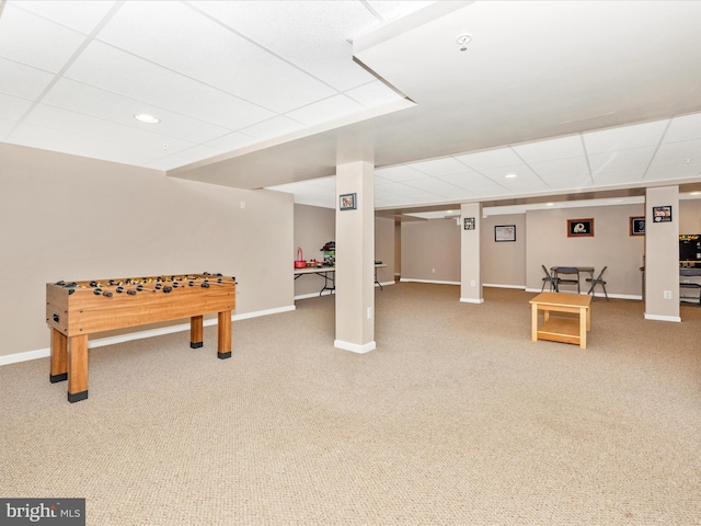 rec room featuring a drop ceiling and carpet flooring