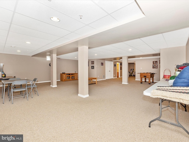 rec room with a paneled ceiling and carpet flooring