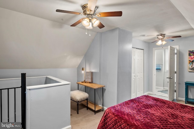 bedroom featuring baseboards, light colored carpet, a ceiling fan, a closet, and lofted ceiling