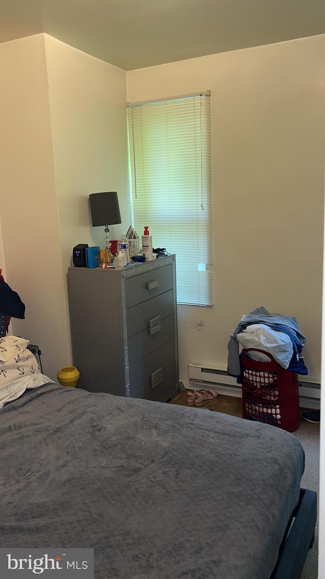 bedroom featuring a baseboard radiator