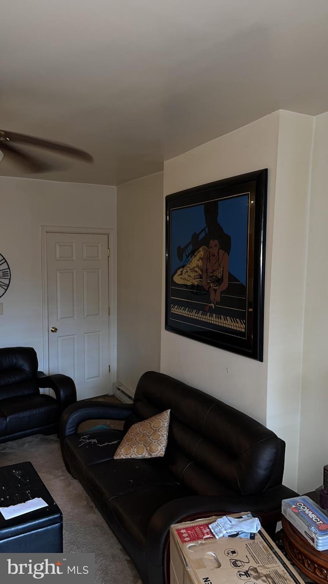 carpeted living room with a baseboard radiator