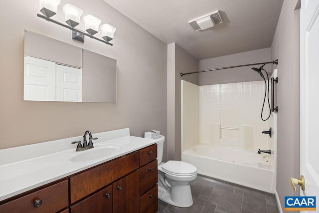 full bathroom with vanity, tile patterned floors, toilet, and washtub / shower combination