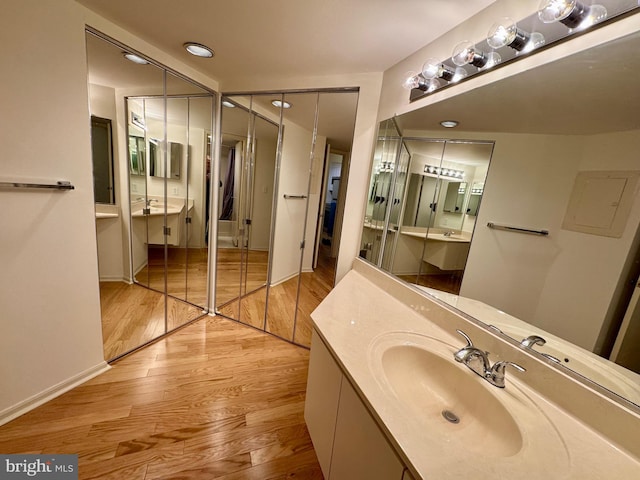 bathroom featuring vanity and wood finished floors