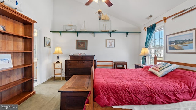 bedroom with light carpet, baseboards, visible vents, and high vaulted ceiling