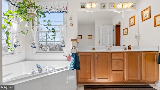 full bath featuring a bath and double vanity