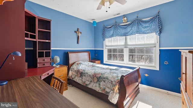 bedroom featuring a ceiling fan, light carpet, visible vents, and baseboards