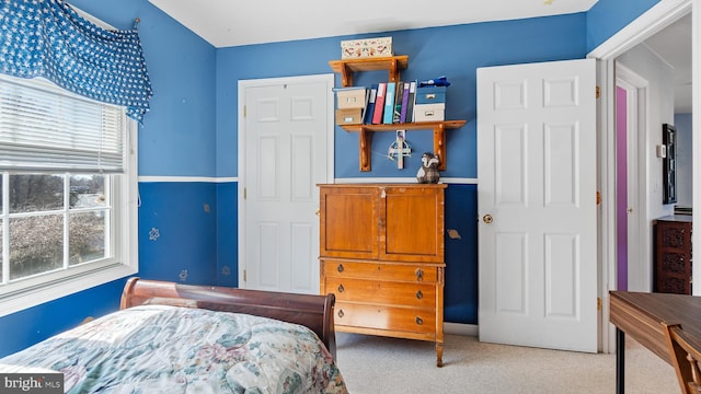 bedroom with light colored carpet