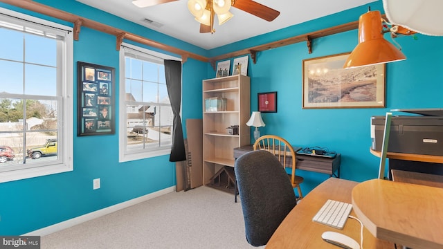 office with carpet floors, plenty of natural light, visible vents, and baseboards