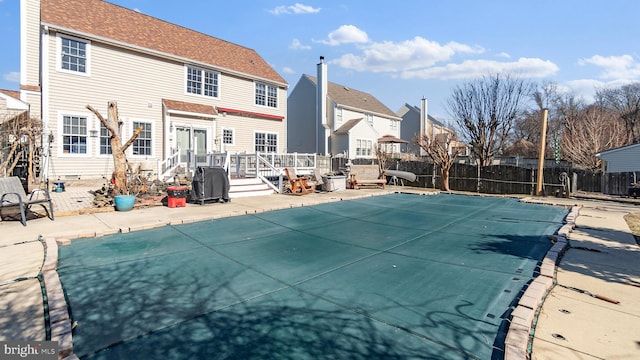 view of pool with fence, grilling area, and a fenced in pool