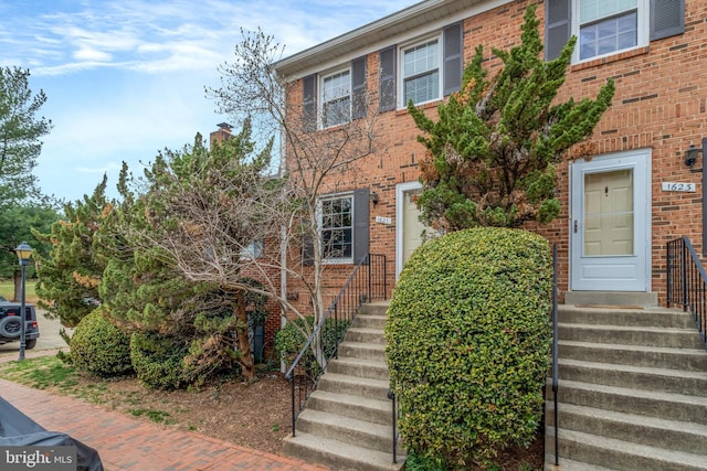 view of front of home with brick siding