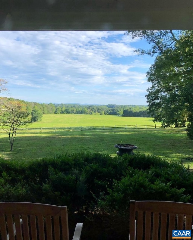 view of yard with a rural view