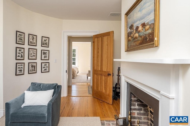 sitting room featuring hardwood / wood-style flooring