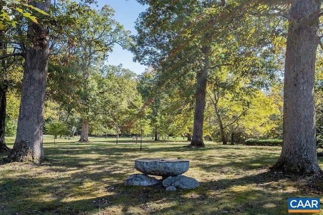 surrounding community featuring a lawn