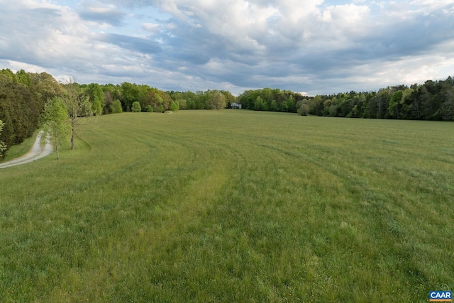 view of yard with a rural view