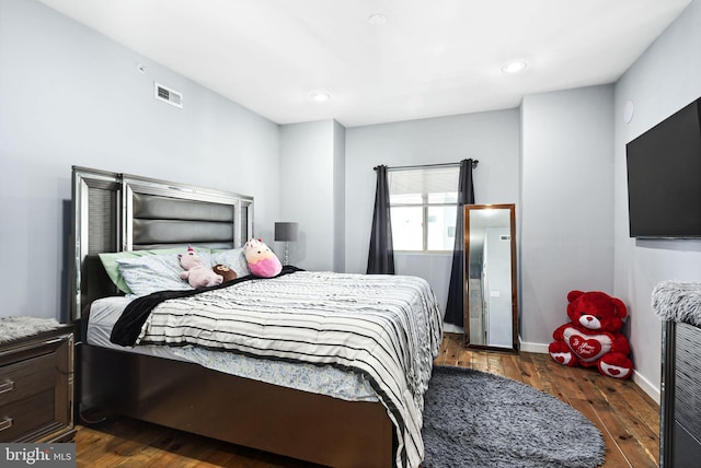 bedroom featuring dark hardwood / wood-style floors