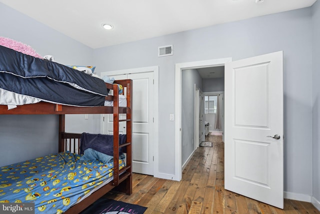 bedroom with hardwood / wood-style flooring