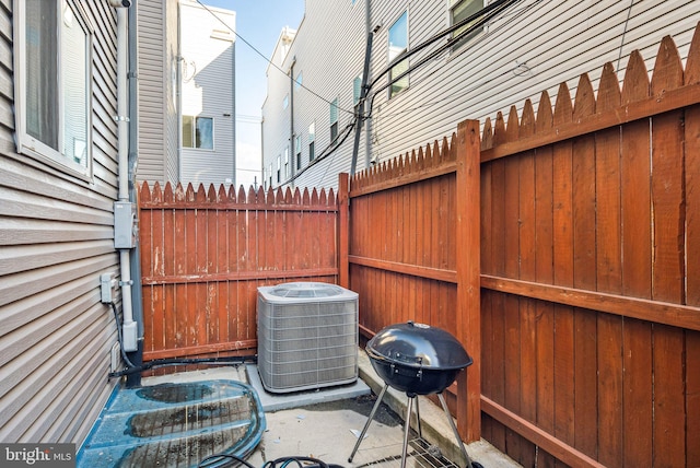 view of patio / terrace with cooling unit and grilling area