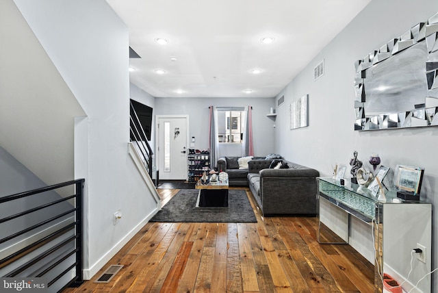 living room featuring dark hardwood / wood-style flooring