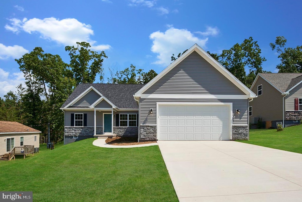 craftsman-style home with a garage and a front lawn