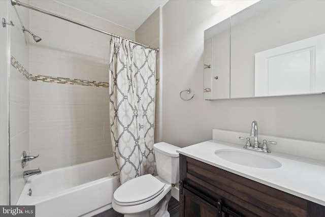 full bathroom with shower / bath combo, vanity, and toilet