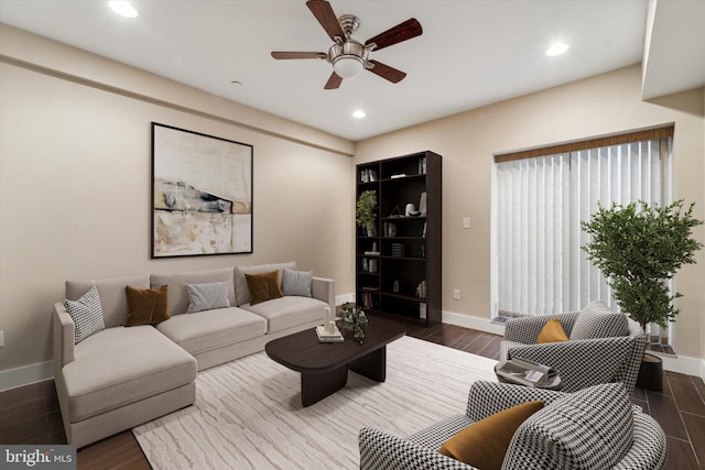 living room with dark hardwood / wood-style floors and ceiling fan