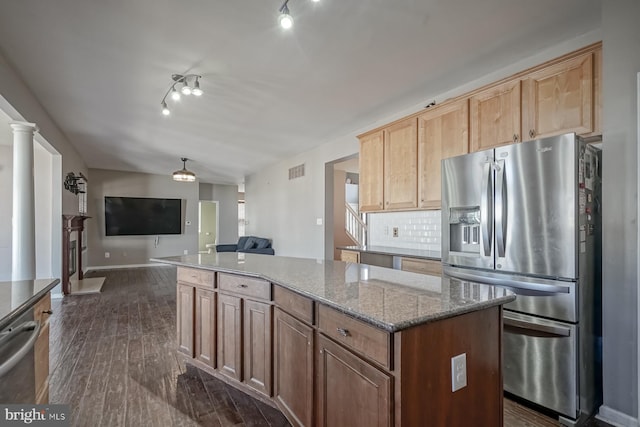 kitchen featuring dark wood-style flooring, visible vents, open floor plan, appliances with stainless steel finishes, and backsplash