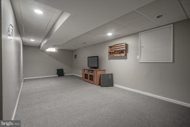 finished basement with carpet, a drop ceiling, baseboards, and recessed lighting