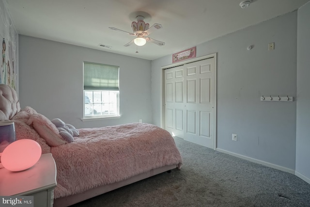 carpeted bedroom with baseboards, visible vents, ceiling fan, and a closet