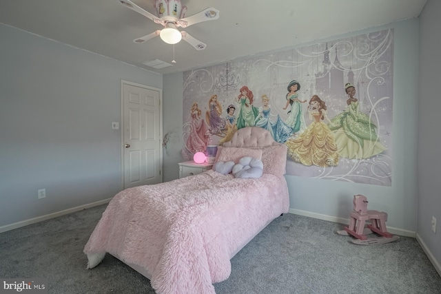 bedroom with a ceiling fan, baseboards, and carpet flooring