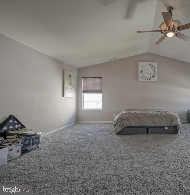 unfurnished bedroom with visible vents, baseboards, a ceiling fan, carpet, and vaulted ceiling