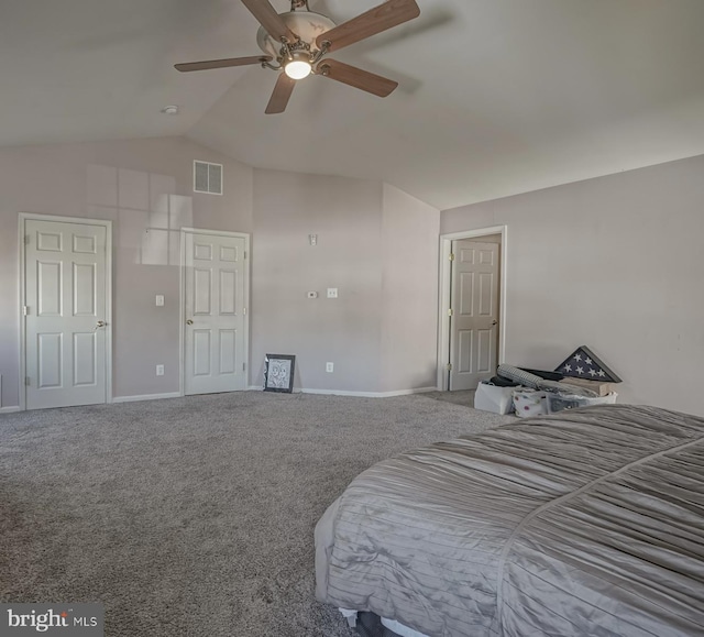 bedroom featuring lofted ceiling, baseboards, visible vents, and carpet