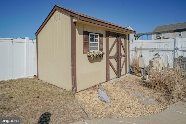 view of shed with fence