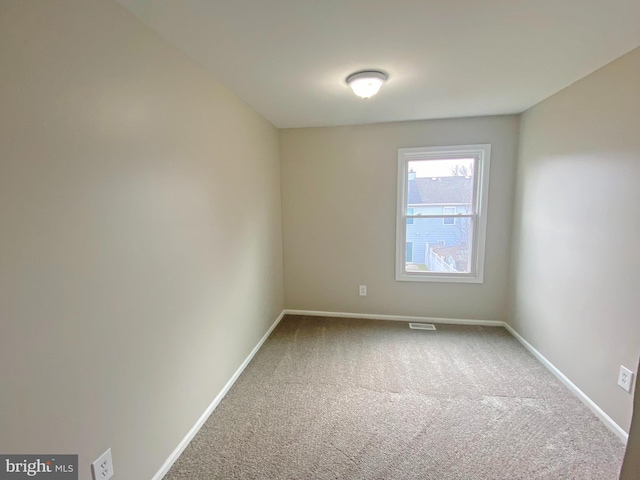 unfurnished room with carpet flooring